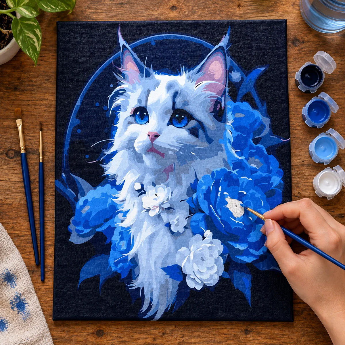 Complete White Cat with Blue Hydrangeas numbered canvas being painted with acrylic paints and brushes