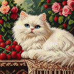 Close-up of diamond drill details in a white cat resting beside roses on an antique table.