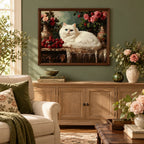 Home decor scene showing a white cat resting beside roses on an antique table displayed on a wall.