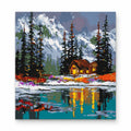 Winter Cabin by the Lake paint by numbers artwork on a front-facing canvas against a white background