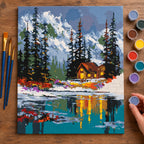 Complete Winter Cabin by the Lake numbered canvas being painted with acrylic paints and brushes