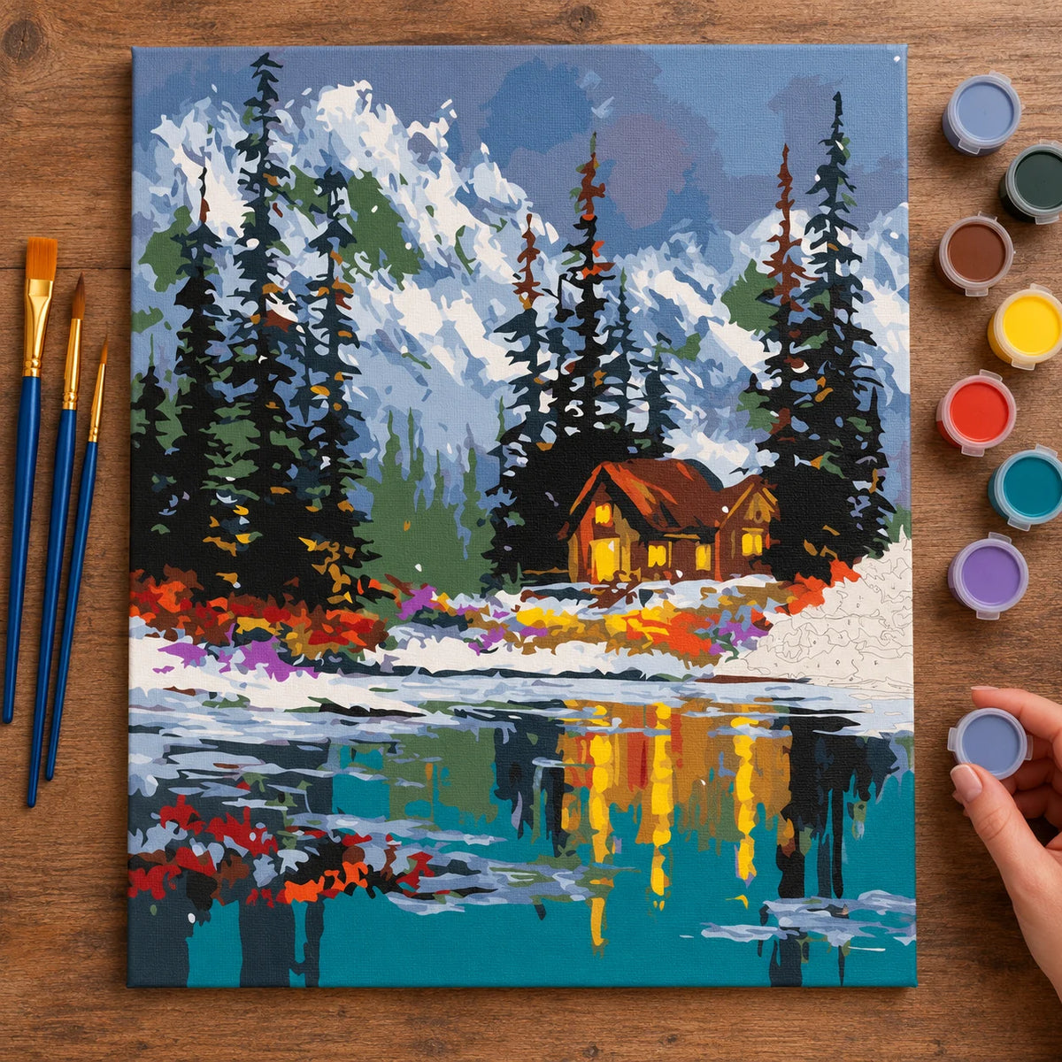 Complete Winter Cabin by the Lake numbered canvas being painted with acrylic paints and brushes