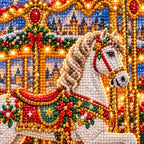 Close-up diamond drill detail of a golden carousel with white horses glowing in a snowy holiday village artwork