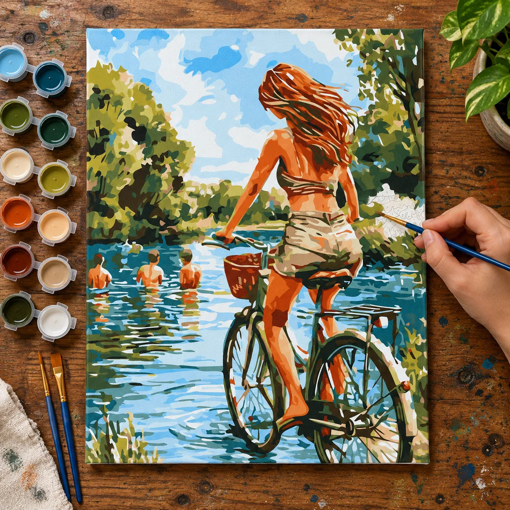Complete Woman Cycling by the Lake numbered canvas being painted with acrylic paints and brushes