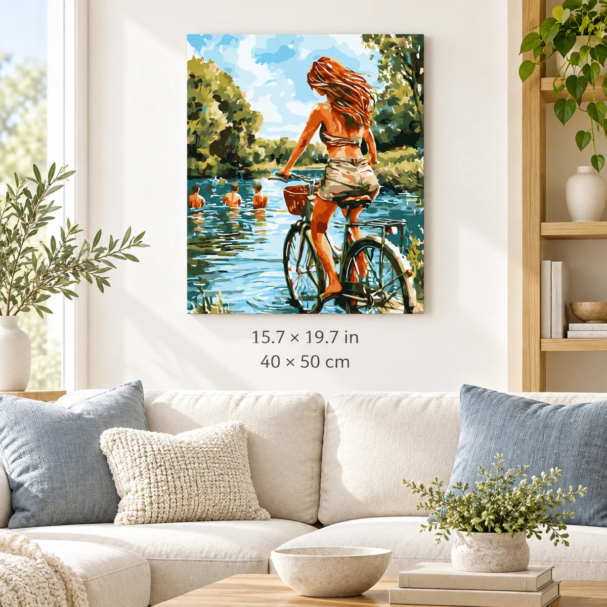 Woman Cycling by the Lake shown in a styled room with 15.7 × 19.7 in and 40 × 50 cm dimensions