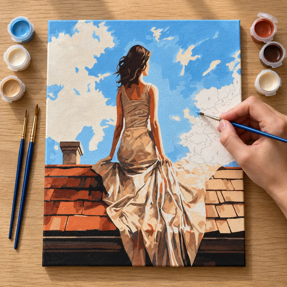 Complete Woman in White Dress on Rooftop numbered canvas being painted with acrylic paints and brushes