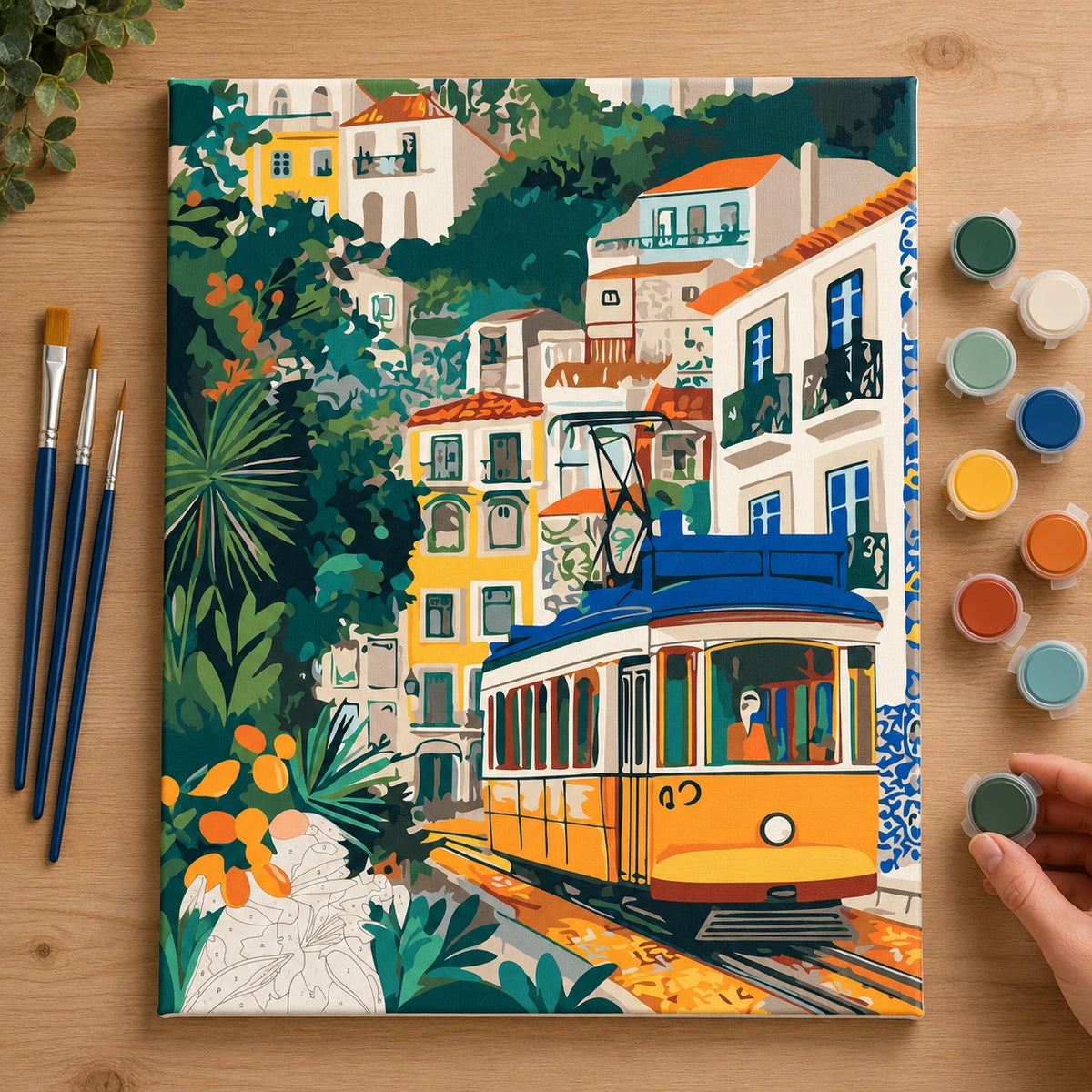 Complete Yellow Tram Through Lisbon numbered canvas being painted with acrylic paints and brushes